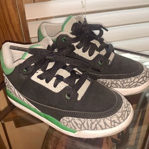 Black , grey and green Jordan’s . Kids gym shoes size 11c .